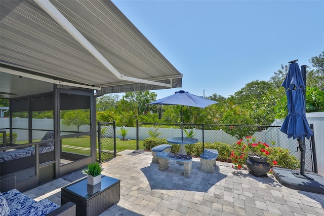 214 Lookout Dr, Apollo Beach, FL 33572 - fenced backyard with a patio area and a sunroom