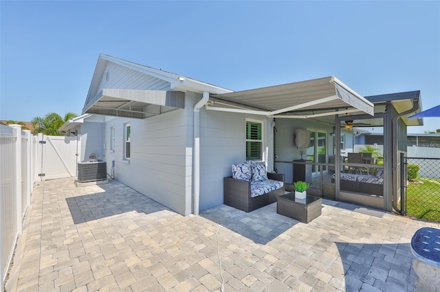214 Lookout Dr, Apollo Beach, FL 33572 - rear view of house with a gate, a patio, and cooling unit