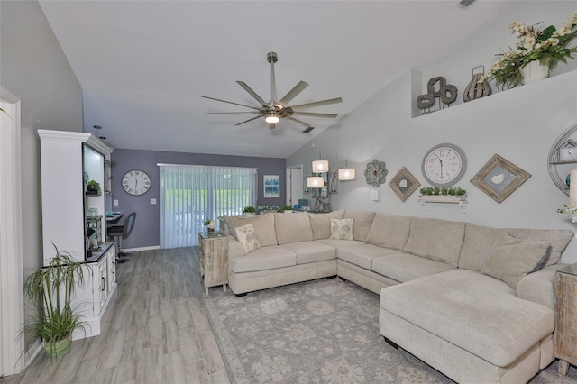 214 Lookout Dr, Apollo Beach, FL 33572 - living room with ceiling fan, high vaulted ceiling, wood finished floors, and baseboards