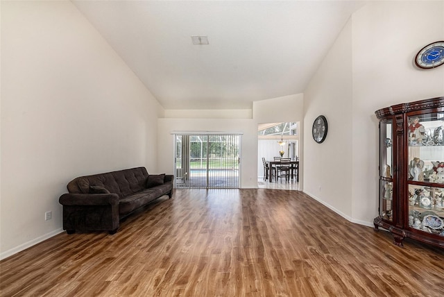 14181 Cornewall Ln, Spring Hill, FL 34609 - living area featuring wood finished floors and baseboards