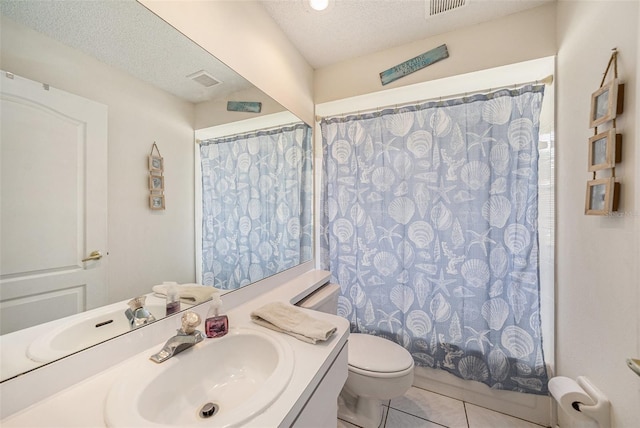 14181 Cornewall Ln, Spring Hill, FL 34609 - full bathroom with toilet, vanity, tile patterned flooring, and a textured ceiling