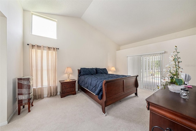 14181 Cornewall Ln, Spring Hill, FL 34609 - bedroom with access to exterior, light colored carpet, and high vaulted ceiling
