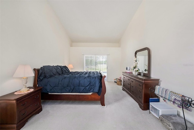 14181 Cornewall Ln, Spring Hill, FL 34609 - bedroom featuring light colored carpet, access to exterior, and lofted ceiling