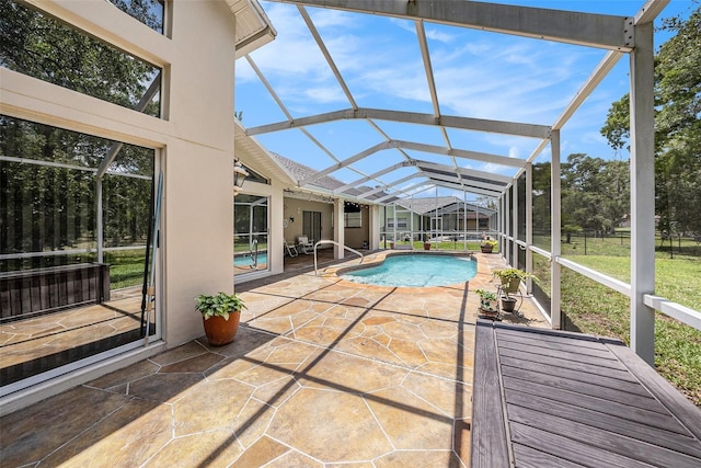 14181 Cornewall Ln, Spring Hill, FL 34609 - swimming pool featuring a patio area and glass enclosure