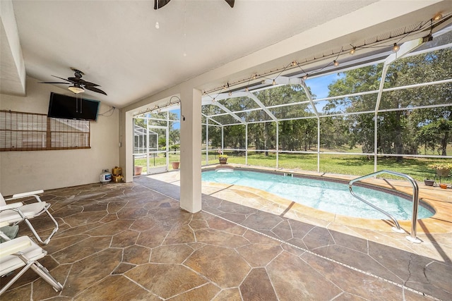 14181 Cornewall Ln, Spring Hill, FL 34609 - swimming pool with ceiling fan, a patio, and glass enclosure