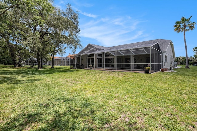 14181 Cornewall Ln, Spring Hill, FL 34609 - view of grassy yard with glass enclosure
