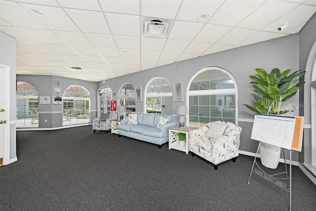 14181 Cornewall Ln, Spring Hill, FL 34609 - carpeted living room with a drop ceiling and baseboards