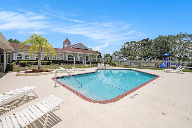 14181 Cornewall Ln, Spring Hill, FL 34609 - community pool with a patio