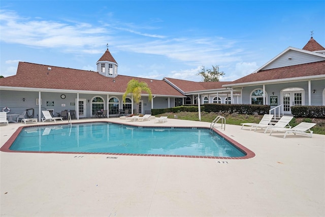 14181 Cornewall Ln, Spring Hill, FL 34609 - community pool featuring a patio