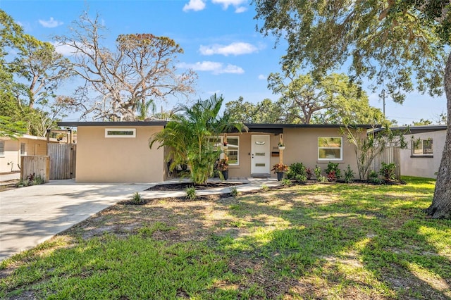 310 55th Ave S, Saint Petersburg, FL 33705 - view of front of home featuring stucco siding