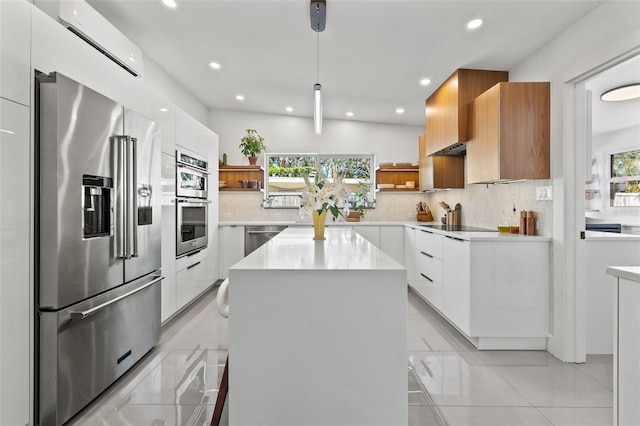 310 55th Ave S, Saint Petersburg, FL 33705 - kitchen with open shelves, appliances with stainless steel finishes, modern cabinets, light countertops, and recessed lighting