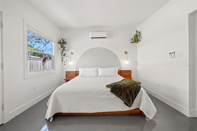 310 55th Ave S, Saint Petersburg, FL 33705 - bedroom featuring a wall mounted air conditioner and baseboards