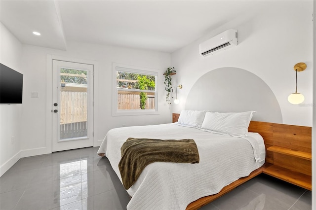310 55th Ave S, Saint Petersburg, FL 33705 - bedroom featuring a wall mounted air conditioner, access to exterior, tile patterned flooring, and baseboards