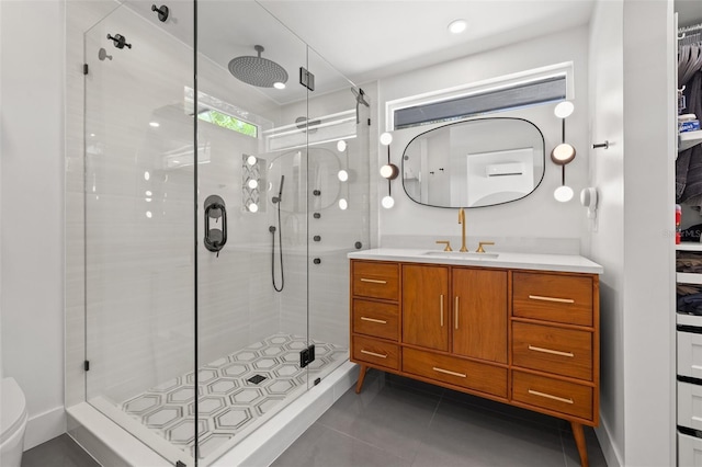 310 55th Ave S, Saint Petersburg, FL 33705 - full bathroom with a shower stall, vanity, tile patterned flooring, and toilet