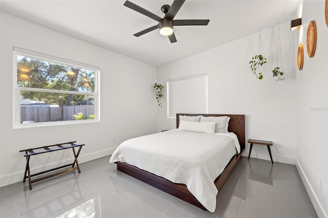 310 55th Ave S, Saint Petersburg, FL 33705 - bedroom with baseboards, tile patterned flooring, and a ceiling fan