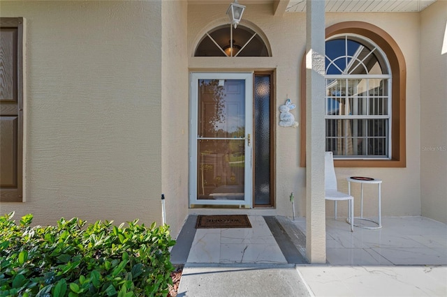 9314 Alta Sol Way, New Port Richey, FL 34655 - doorway to property with stucco siding