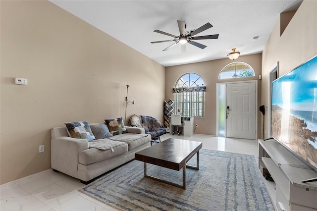 9314 Alta Sol Way, New Port Richey, FL 34655 - living room featuring ceiling fan, baseboards, and light marble finish floors