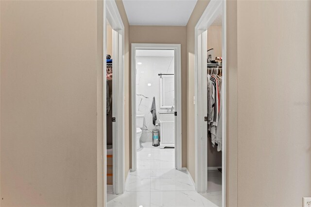 9314 Alta Sol Way, New Port Richey, FL 34655 - hall featuring baseboards and light marble finish floors