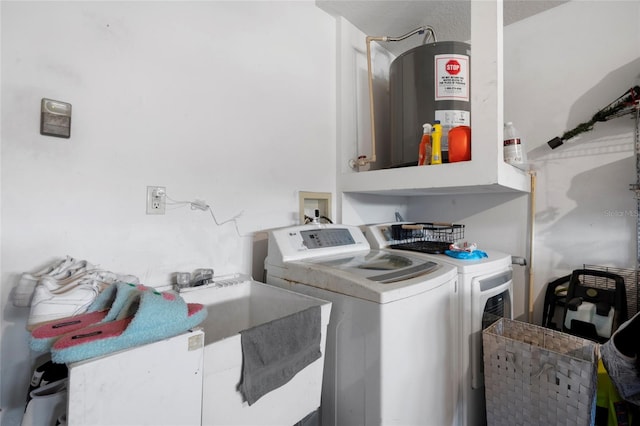9314 Alta Sol Way, New Port Richey, FL 34655 - laundry room featuring washer and clothes dryer, cabinet space, and water heater
