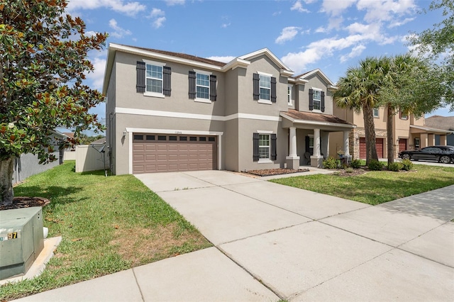 11206 Coventry Grove Cir, Lithia, FL 33547 - view of front of house with stucco siding, a garage, a front yard, and concrete driveway