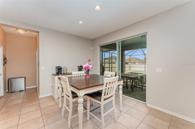 11206 Coventry Grove Cir, Lithia, FL 33547 - dining area featuring light tile patterned floors, baseboards, and recessed lighting