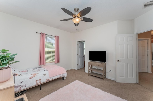 11206 Coventry Grove Cir, Lithia, FL 33547 - carpeted bedroom with baseboards and ceiling fan