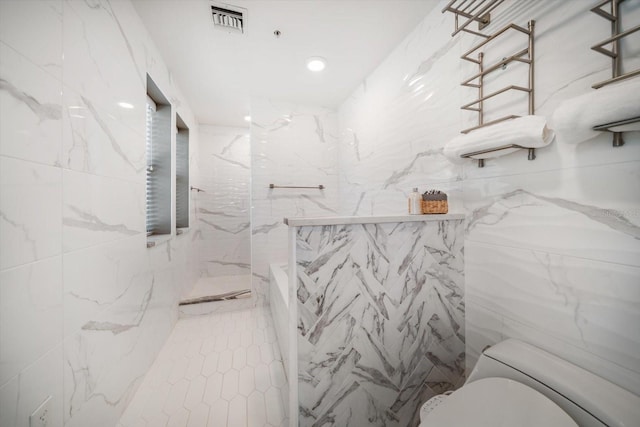 215 18th Ave, Indian Rocks Beach, FL 33785 - full bath featuring toilet, a marble finish shower, and tile walls
