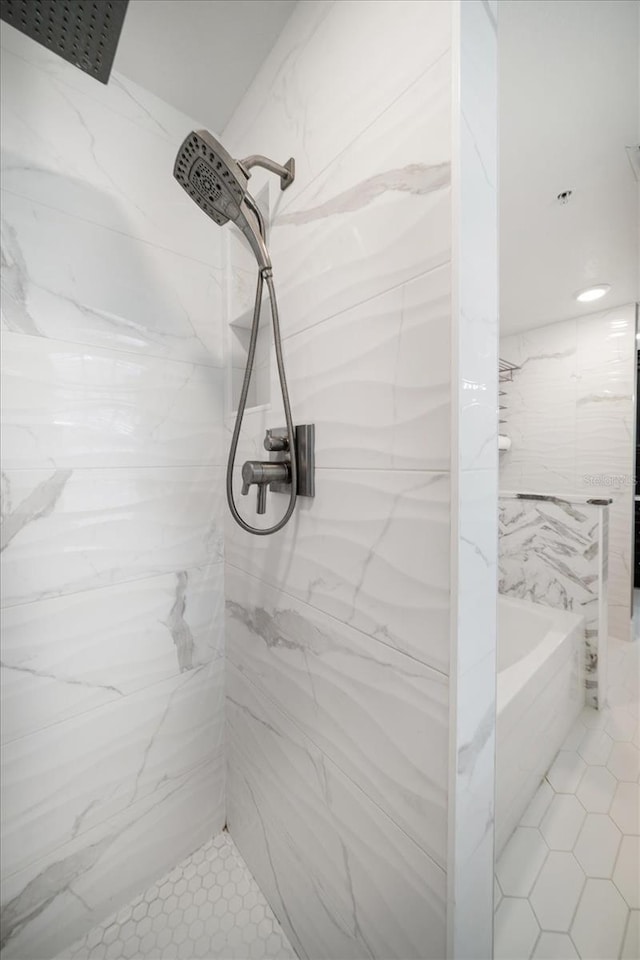 215 18th Ave, Indian Rocks Beach, FL 33785 - bathroom with a marble finish shower, a tub to relax in, and tile patterned flooring