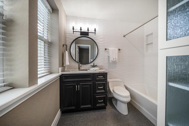 215 18th Ave, Indian Rocks Beach, FL 33785 - full bathroom featuring toilet, vanity, shower / washtub combination, and tile patterned flooring