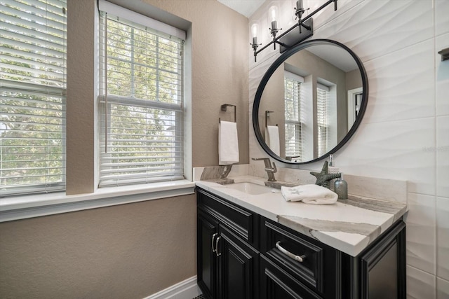 215 18th Ave, Indian Rocks Beach, FL 33785 - bathroom with vanity, healthy amount of natural light, and a textured wall