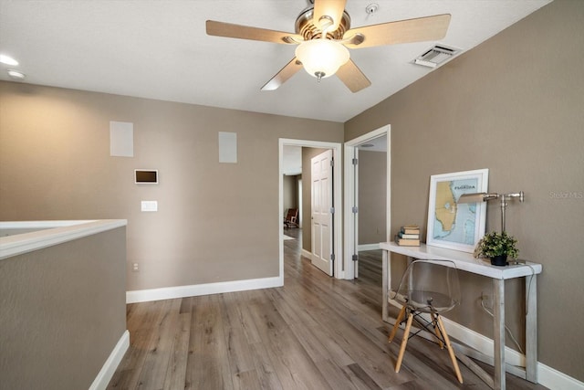 215 18th Ave, Indian Rocks Beach, FL 33785 - office space featuring ceiling fan, baseboards, and wood finished floors