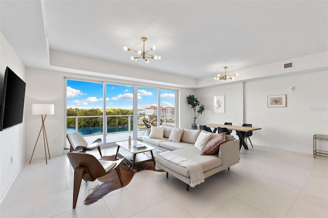 1020 Sunset Point Rd Unit 410, Clearwater, FL 33756 - living area with a chandelier and light tile patterned flooring