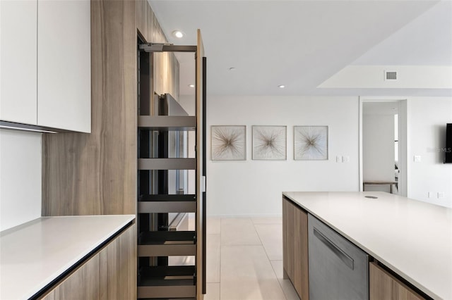 1020 Sunset Point Rd Unit 410, Clearwater, FL 33756 - kitchen featuring modern cabinets, light countertops, light tile patterned flooring, and recessed lighting