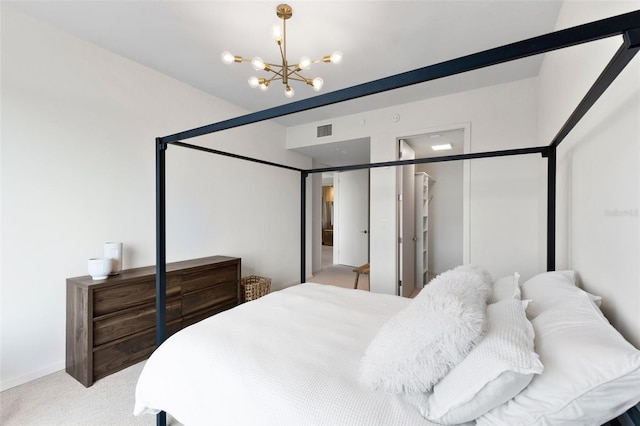 1020 Sunset Point Rd Unit 410, Clearwater, FL 33756 - bedroom featuring a chandelier and light colored carpet