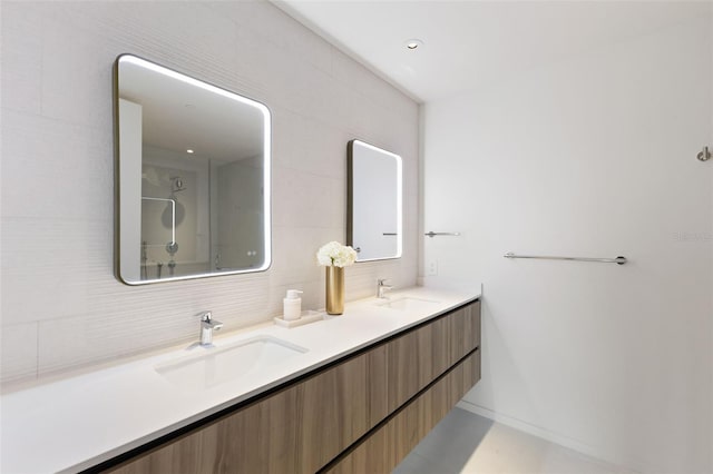 1020 Sunset Point Rd Unit 410, Clearwater, FL 33756 - full bathroom with double vanity, tasteful backsplash, and a shower