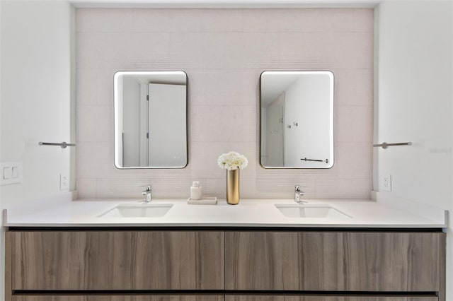1020 Sunset Point Rd Unit 410, Clearwater, FL 33756 - bathroom with double vanity and decorative backsplash