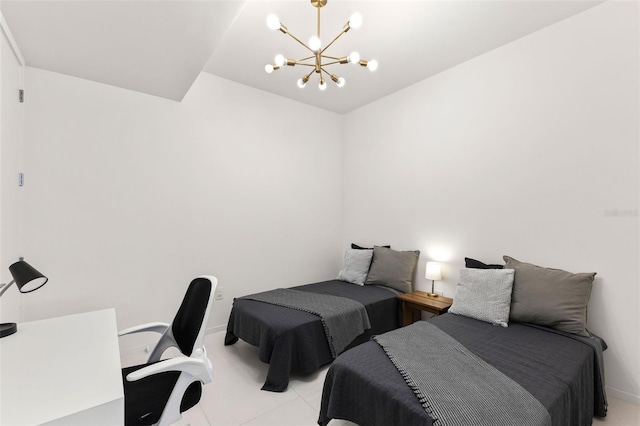 1020 Sunset Point Rd Unit 410, Clearwater, FL 33756 - bedroom featuring a chandelier, light tile patterned floors, and baseboards