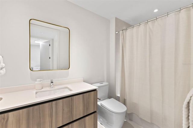 1020 Sunset Point Rd Unit 410, Clearwater, FL 33756 - bathroom featuring vanity, toilet, and shower / bathtub combination with curtain