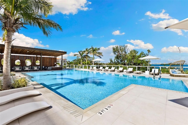 1020 Sunset Point Rd Unit 410, Clearwater, FL 33756 - community pool featuring a patio