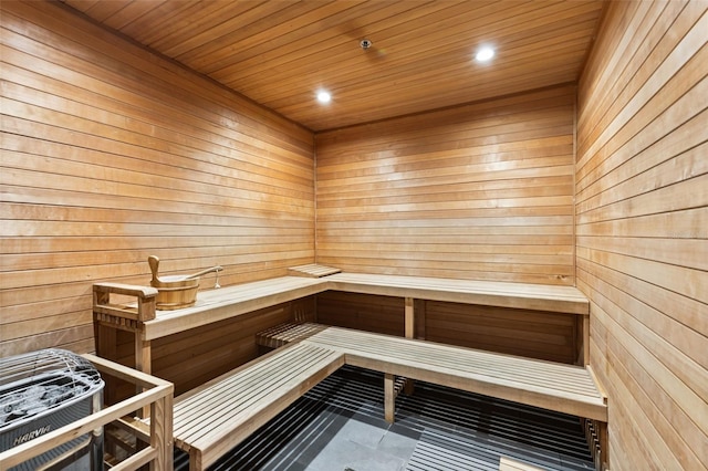 1020 Sunset Point Rd Unit 410, Clearwater, FL 33756 - relaxing sauna with wooden walls, recessed lighting, tile patterned flooring, and wooden ceiling
