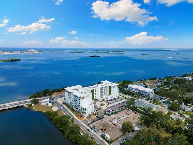 1020 Sunset Point Rd Unit 410, Clearwater, FL 33756 - drone / aerial view of a large body of water and apartment complex / building