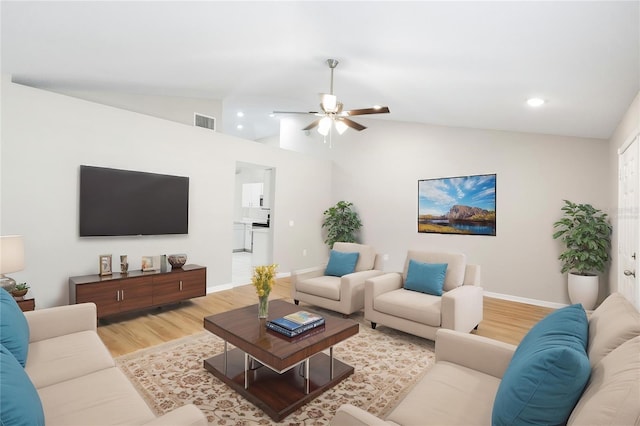 9721 Fredericksburg Rd, Tampa, FL 33635 - living room with lofted ceiling, light wood-style floors, ceiling fan, baseboards, and recessed lighting