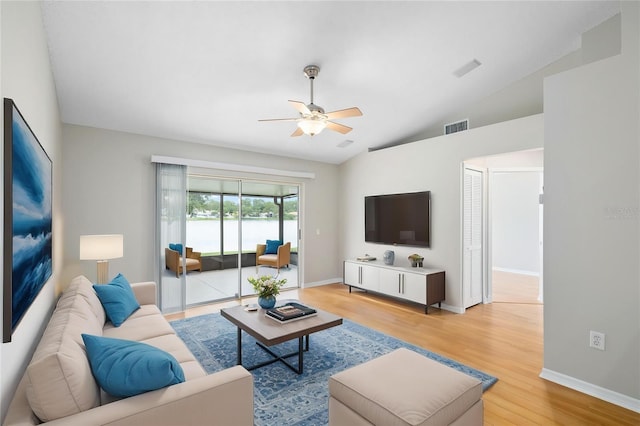 9721 Fredericksburg Rd, Tampa, FL 33635 - living area featuring ceiling fan, lofted ceiling, light wood finished floors, and baseboards