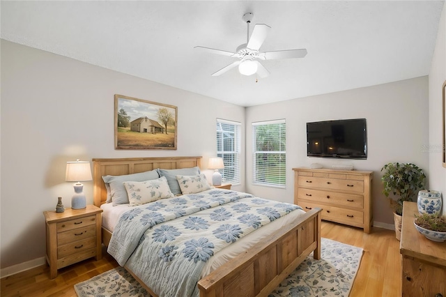 9721 Fredericksburg Rd, Tampa, FL 33635 - bedroom featuring light wood-style flooring, baseboards, and a ceiling fan