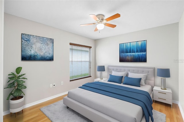 9721 Fredericksburg Rd, Tampa, FL 33635 - bedroom featuring light wood-style floors, baseboards, and a ceiling fan
