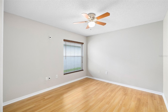 9721 Fredericksburg Rd, Tampa, FL 33635 - spare room featuring baseboards, light wood-style floors, ceiling fan, and a textured ceiling
