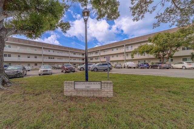 2441 Persian Dr Unit 61, Clearwater, FL 33763 - view of building exterior with uncovered parking