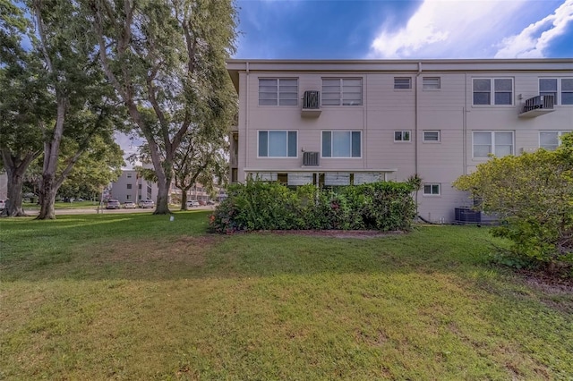 2441 Persian Dr Unit 61, Clearwater, FL 33763 - view of building exterior featuring central AC unit