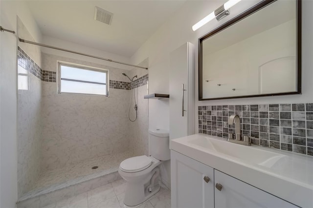 2441 Persian Dr Unit 61, Clearwater, FL 33763 - full bath with toilet, vanity, a tile shower, and tasteful backsplash