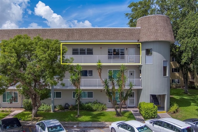 2441 Persian Dr Unit 61, Clearwater, FL 33763 - view of building exterior featuring uncovered parking